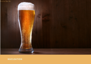 what makes beer keep bubbling once it's in a beer glass - Nucleation